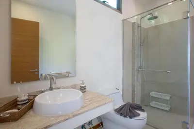 a bathroom with a sink and a toilet and a shower at VILLA RAJA 4BR Private pool villa in Rawai Beach