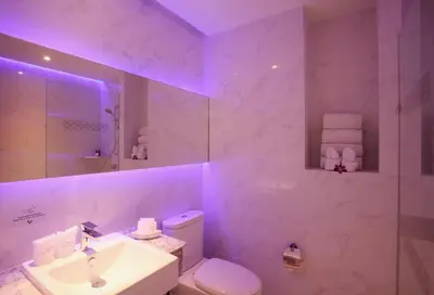 a white bathroom with a sink and a toilet at The Verandah Aonang in Ao Nang Beach