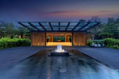 a building with a fountain in the middle of a courtyard at Renaissance Phuket Resort & Spa in Mai Khao Beach