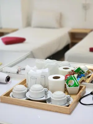 a tray with dishes and other items on a table at The Palace Aonang Resort in Ao Nang Beach