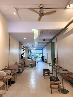 a hallway with tables and chairs in a restaurant at The Palace Aonang Resort in Ao Nang Beach