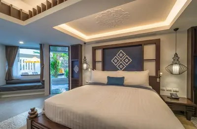 a bedroom with a large bed and a balcony at Aonang Princeville Villa Resort & Spa - GHA WellHotel-Halal Certified, Krabi, Thailand in Ao Nang Beach
