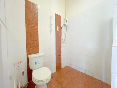 a bathroom with a toilet and a shower at The Endless Bangtao Residence TV2 AND TV 3 in Bang Tao Beach