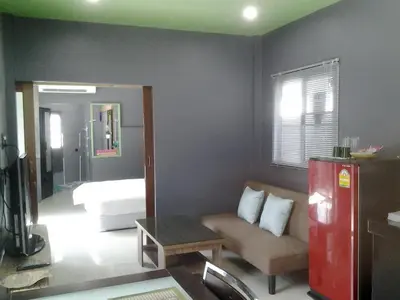 a living room with a couch and a bed at The Endless Bangtao Residence CAC 4 in Bang Tao Beach