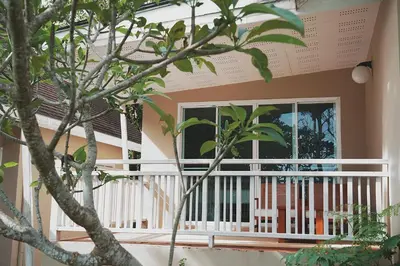 a balcony with a window and a tree at Bayview Resort Phi Phi Island - Beach Front Resort in Phi Phi Don