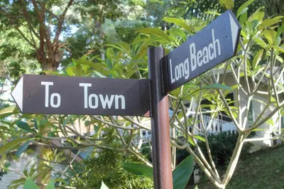 a street sign that reads to town and to downtown at Bayview Resort Phi Phi Island - Beach Front Resort in Phi Phi Don