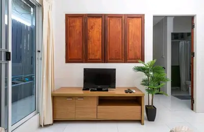 a room with a desk with a television on it at The Endless Bangtao Residence ST2 in Bang Tao Beach