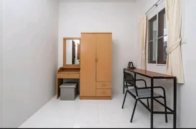 a room with a desk and a table and a mirror at The Endless Bangtao Residence ST2 in Bang Tao Beach