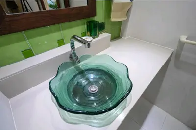 a green sink on a counter in a bathroom at The Endless Bangtao Residence ST2 in Bang Tao Beach