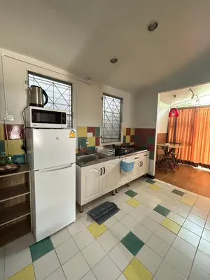 a kitchen with a white refrigerator and a sink at The Endless Bangtao Residence CAC 2 in Bang Tao Beach