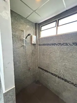 a bathroom with a shower with a window at The Endless Bangtao Residence CAC 2 in Bang Tao Beach