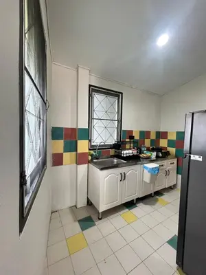 a kitchen with colorful tiles on the walls and a sink at The Endless Bangtao Residence CAC 1 in Bang Tao Beach