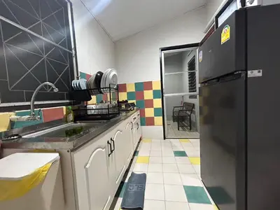 a kitchen with a sink and a refrigerator at The Endless Bangtao Residence CAC 1 in Bang Tao Beach