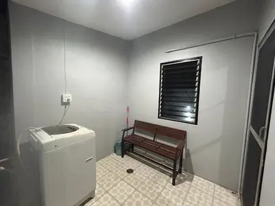 a small bathroom with a bench and a window at The Endless Bangtao Residence CAC 1 in Bang Tao Beach