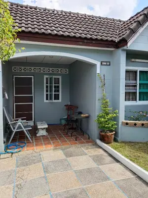 a small house with a patio at The Endless Bangtao Residence CAC 1 in Bang Tao Beach
