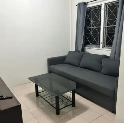 a living room with a couch and a coffee table at The Endless Bangtao Residence PM12 in Bang Tao Beach