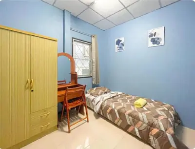 a bedroom with a desk and a bed and a desk at The Endless Bangtao Residence PM12 in Bang Tao Beach