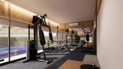 a gym with several treadmills and treadleys at OUTRIGGER Phi Phi Island Resort in Phi Phi Don