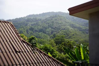 a view of a mountain from the roof of a house at The Endless Bangtao Residence CHAT 2 in Bang Tao Beach