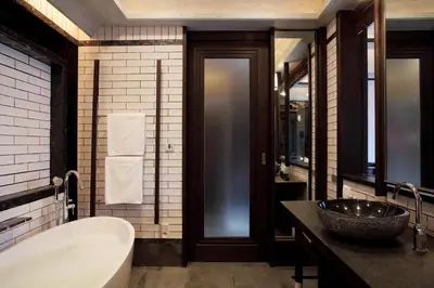 a bathroom with a tub and a sink at Baba Beach Club Phuket Natai Luxury Pool Villa Hotel by Sri panwa in Natai Beach