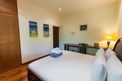 a bedroom with a bed with a blue stuffed animal on it at Viola Pool Villa Elegant Elegant Villa In Paradise in Rawai Beach