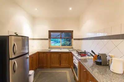 a kitchen with a stainless steel refrigerator and a window at Viola Pool Villa Elegant Elegant Villa In Paradise in Rawai Beach