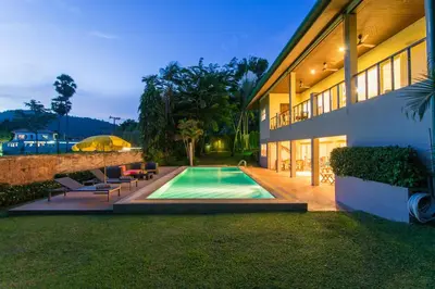 a house with a swimming pool in the yard at Viola Pool Villa Elegant Elegant Villa In Paradise in Rawai Beach