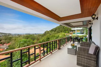 a balcony with a view of the mountains at Baan Chom View Kamala - SHA Plus in Kamala Beach
