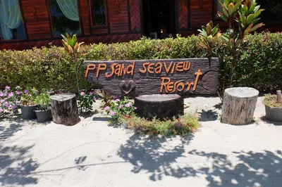 a sign that says pst and seawlevard reborn in a garden at Phi Phi Sand Sea View Resort in Phi Phi Don