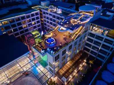 an overhead view of a building at night with lights at The Kee Resort & Spa in Patong Beach