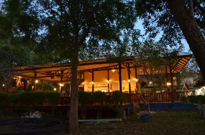 a large building with lights on it at night at Phitharom PP Resort in Phi Phi Don