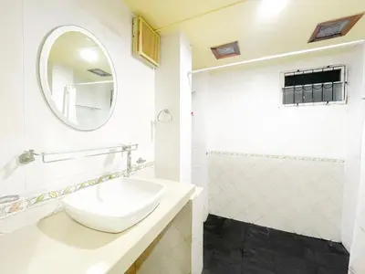 a white bathroom with a sink and a mirror at The Endless Resident Private Pool Villa PSU in Bang Tao Beach