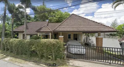 a house with a fence in front of it at The Endless Resident Private Pool Villa PSU in Bang Tao Beach