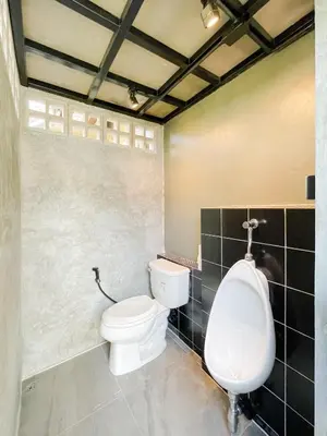a bathroom with a toilet and a urinal at The Endless Resident Private Pool Villa PSU in Bang Tao Beach