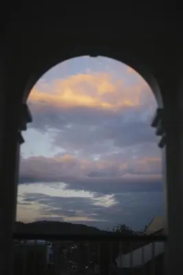 a view of the sky through a window at Shunli Hotel - SHA Extra Plus in Phuket Town