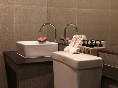 a bathroom with a toilet and a sink at Phi Phi Villa Resort in Phi Phi Don