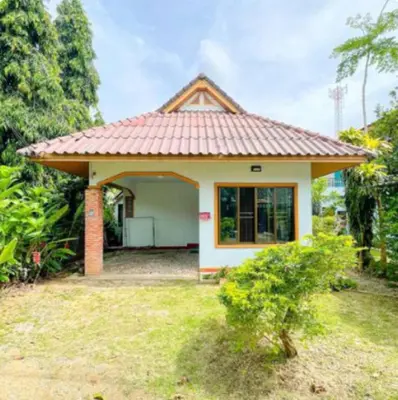 a small white house with a red roof at The Endless Bangtao Residence Chat 1 in Bang Tao Beach
