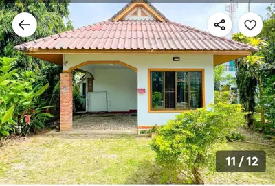 a small house with a tile roof at The Endless Bangtao Residence Chat 1 in Bang Tao Beach