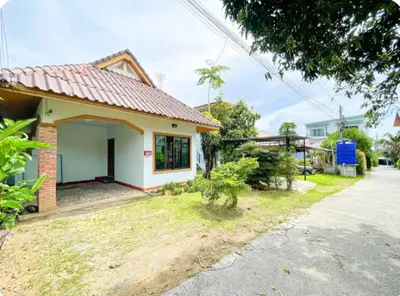 a small house with a red roof at The Endless Bangtao Residence Chat 1 in Bang Tao Beach