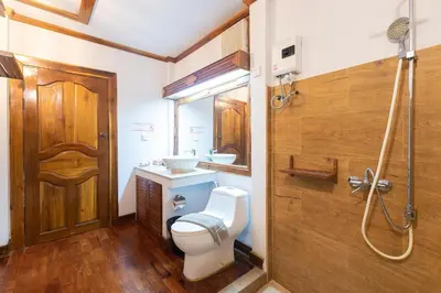a bathroom with a toilet and a sink and a shower at Phi Phi The Beach Resort in Phi Phi Don