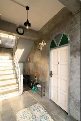 a room with a white door and a staircase at The Endless Bangtao Apartment AC1234 in Bang Tao Beach