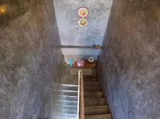 a staircase in a room with a stair case at The Endless Bangtao Apartment AC1234 in Bang Tao Beach