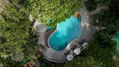 an aerial view of a swimming pool in a resort at Baan Krating Phuket Resort Naiharn-SHA Plus in Nai Harn Beach