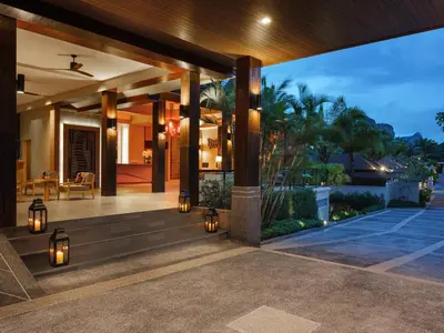 a house with a porch with lights on it at De Malee Pool Villas in Ao Nang Beach