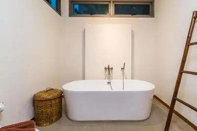 a white bath tub in a bathroom with a ladder at Ka villa private pool & maid by Lofty in Rawai Beach