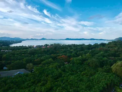 an aerial view of a lake and trees at Ka villa private pool & maid by Lofty in Rawai Beach
