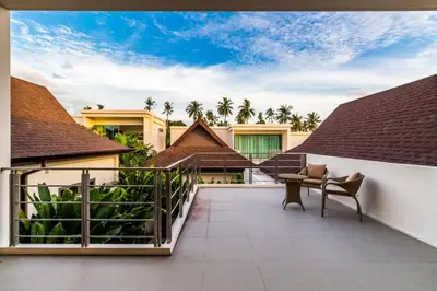 a view of the balcony of a villa at Ka villa private pool & maid by Lofty in Rawai Beach