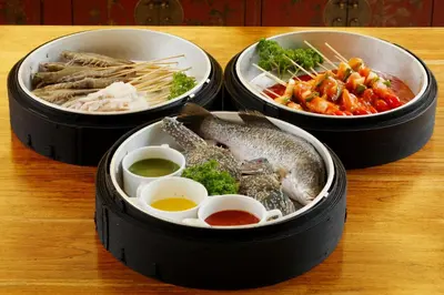 three containers of food on a wooden table at Two Villas HOLIDAY - Oxygen Style Bangtao Beach, Phuket in Bang Tao Beach