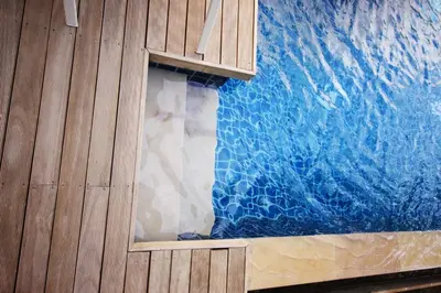 a room with a blue wall and a window at Two Villas HOLIDAY - Oxygen Style Bangtao Beach, Phuket in Bang Tao Beach