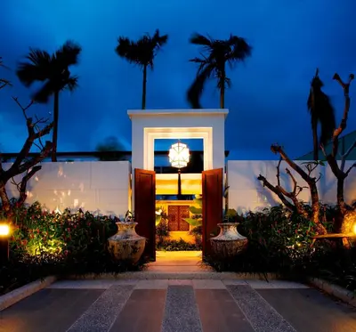 a front door of a building with palm trees at Two Villas HOLIDAY - Oxygen Style Bangtao Beach, Phuket in Bang Tao Beach